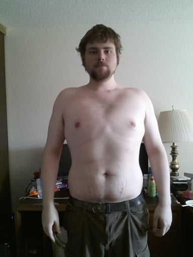 A photo of a 6'5" man showing a fat loss from 316 pounds to 265 pounds. A total loss of 51 pounds.