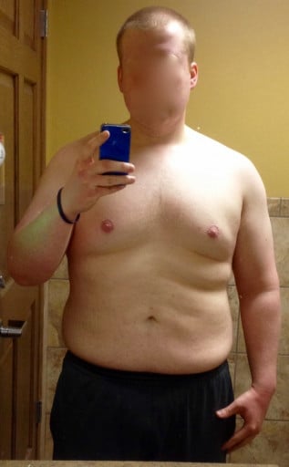 A photo of a 5'11" man showing a weight reduction from 255 pounds to 215 pounds. A respectable loss of 40 pounds.