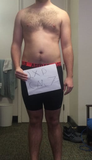 A photo of a 6'1" man showing a snapshot of 205 pounds at a height of 6'1