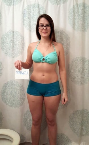 A progress pic of a 5'2" woman showing a snapshot of 119 pounds at a height of 5'2
