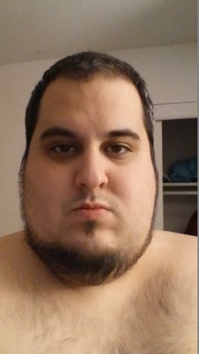 A picture of a 5'11" male showing a weight reduction from 280 pounds to 169 pounds. A net loss of 111 pounds.
