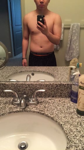 A before and after photo of a 5'7" male showing a fat loss from 168 pounds to 155 pounds. A total loss of 13 pounds.