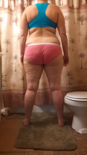A progress pic of a 5'8" woman showing a snapshot of 218 pounds at a height of 5'8