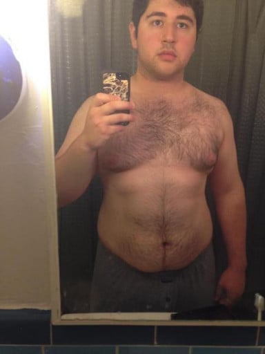 A picture of a 6'1" male showing a weight cut from 254 pounds to 235 pounds. A total loss of 19 pounds.