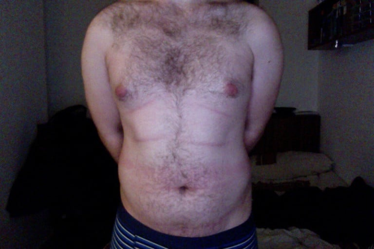A before and after photo of a 5'11" male showing a weight cut from 187 pounds to 155 pounds. A total loss of 32 pounds.