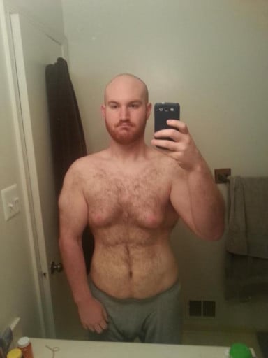 A photo of a 5'11" man showing a weight loss from 318 pounds to 227 pounds. A total loss of 91 pounds.
