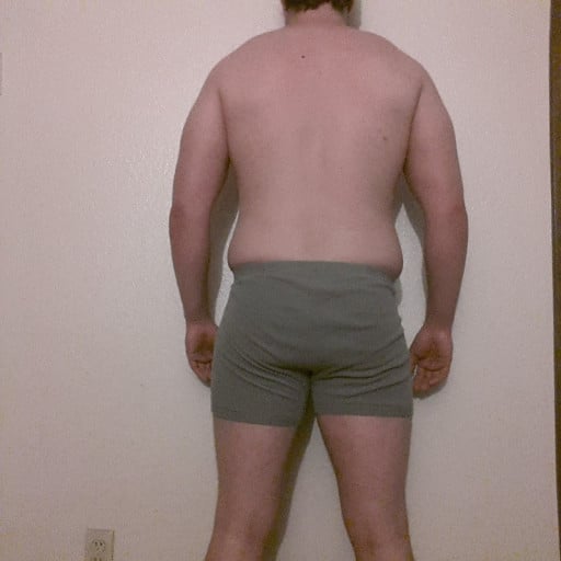 A progress pic of a 5'11" man showing a snapshot of 215 pounds at a height of 5'11
