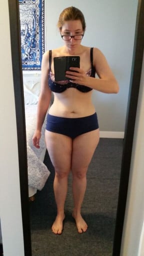 A before and after photo of a 5'5" female showing a weight reduction from 198 pounds to 137 pounds. A net loss of 61 pounds.