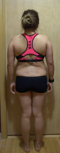 A photo of a 4'11" woman showing a snapshot of 129 pounds at a height of 4'11