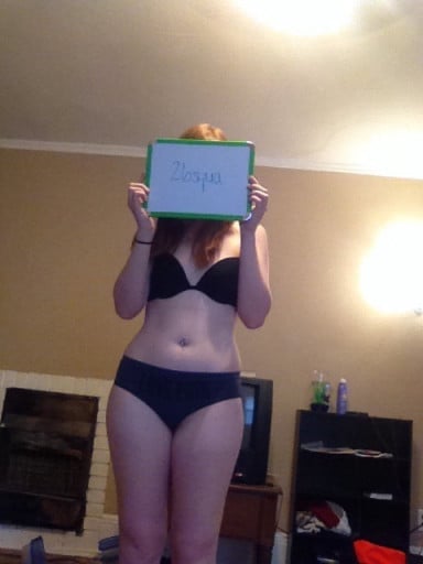A photo of a 5'5" woman showing a snapshot of 132 pounds at a height of 5'5