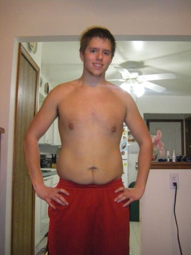 A picture of a 6'2" male showing a weight reduction from 195 pounds to 140 pounds. A net loss of 55 pounds.
