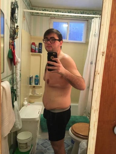 A photo of a 5'8" man showing a weight reduction from 311 pounds to 189 pounds. A total loss of 122 pounds.