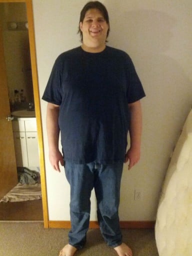 A photo of a 6'6" man showing a weight reduction from 410 pounds to 310 pounds. A respectable loss of 100 pounds.