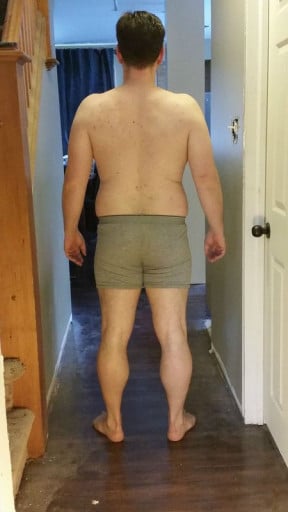 A picture of a 5'9" male showing a snapshot of 209 pounds at a height of 5'9