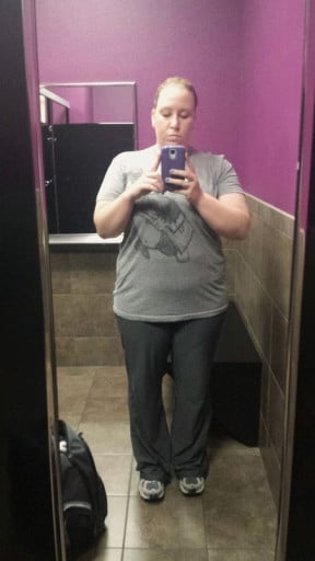 A progress pic of a 5'5" woman showing a weight reduction from 255 pounds to 205 pounds. A total loss of 50 pounds.