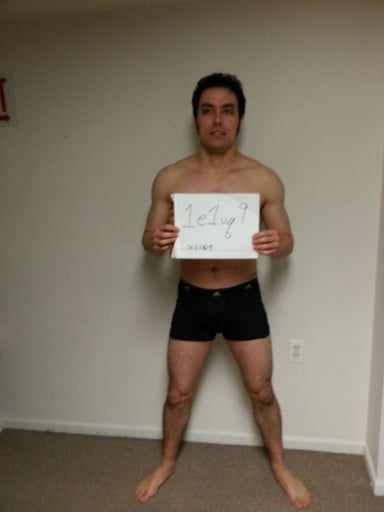 A photo of a 5'11" man showing a snapshot of 165 pounds at a height of 5'11