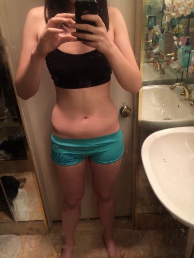 A picture of a 5'11" female showing a weight reduction from 200 pounds to 147 pounds. A net loss of 53 pounds.