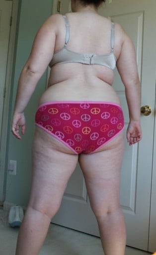 A progress pic of a 5'4" woman showing a snapshot of 210 pounds at a height of 5'4