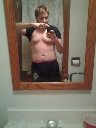 A picture of a 5'8" male showing a weight cut from 210 pounds to 145 pounds. A net loss of 65 pounds.