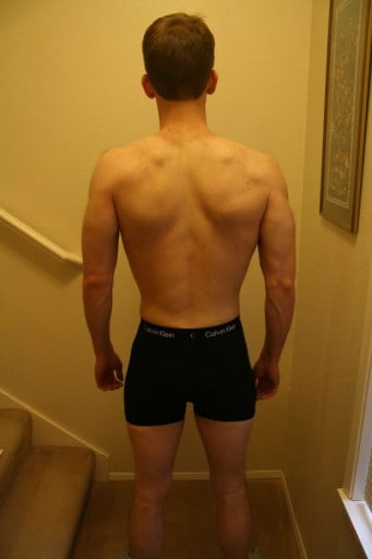 A photo of a 5'11" man showing a muscle gain from 150 pounds to 155 pounds. A net gain of 5 pounds.