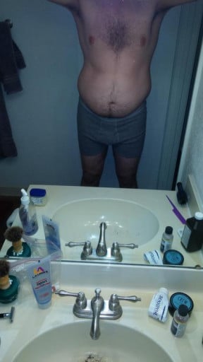A before and after photo of a 6'6" male showing a weight cut from 247 pounds to 225 pounds. A net loss of 22 pounds.