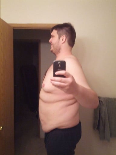 A photo of a 6'6" man showing a weight reduction from 410 pounds to 310 pounds. A respectable loss of 100 pounds.