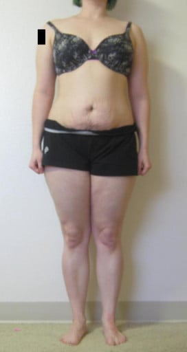 A progress pic of a 5'4" woman showing a snapshot of 153 pounds at a height of 5'4
