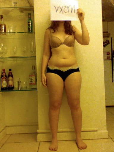 A progress pic of a 5'4" woman showing a snapshot of 143 pounds at a height of 5'4