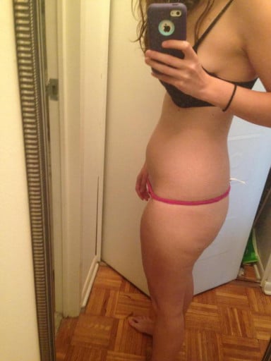 A picture of a 5'2" female showing a weight cut from 165 pounds to 118 pounds. A total loss of 47 pounds.