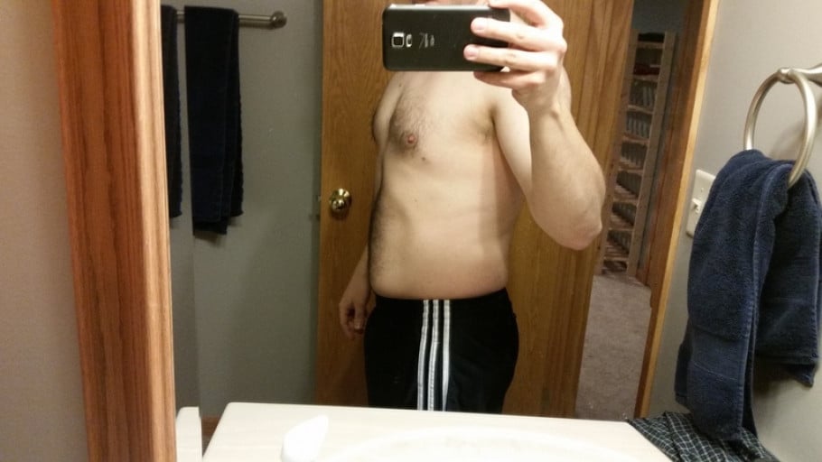 A before and after photo of a 5'9" male showing a weight cut from 215 pounds to 187 pounds. A net loss of 28 pounds.