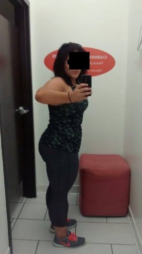 A picture of a 5'3" female showing a weight cut from 225 pounds to 195 pounds. A respectable loss of 30 pounds.