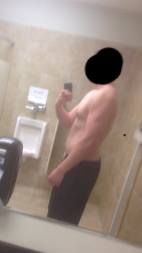 A progress pic of a 6'6" man showing a snapshot of 255 pounds at a height of 6'6