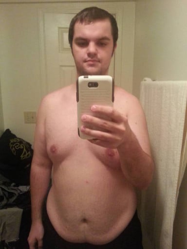 A before and after photo of a 5'11" male showing a fat loss from 300 pounds to 215 pounds. A net loss of 85 pounds.
