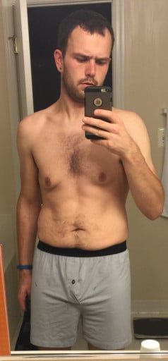 A picture of a 6'0" male showing a weight cut from 282 pounds to 165 pounds. A total loss of 117 pounds.