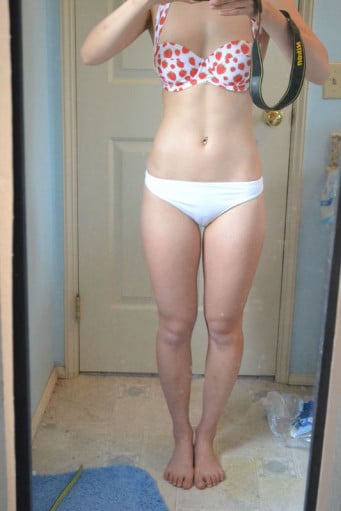 A progress pic of a 5'2" woman showing a snapshot of 117 pounds at a height of 5'2