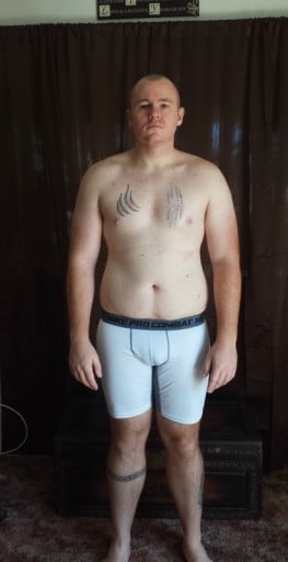 A progress pic of a 5'11" man showing a snapshot of 215 pounds at a height of 5'11