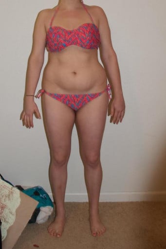 A photo of a 5'5" woman showing a weight loss from 157 pounds to 146 pounds. A net loss of 11 pounds.