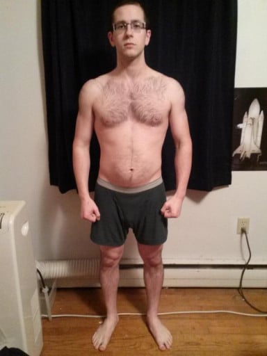 A progress pic of a 5'7" man showing a snapshot of 154 pounds at a height of 5'7