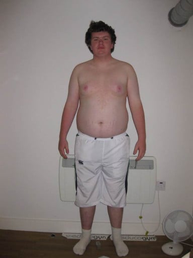 A photo of a 6'0" man showing a weight cut from 260 pounds to 210 pounds. A total loss of 50 pounds.