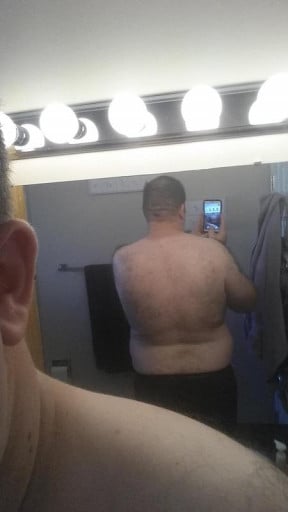 A progress pic of a person at 308 lbs