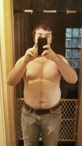 A photo of a 5'11" man showing a weight cut from 220 pounds to 198 pounds. A total loss of 22 pounds.