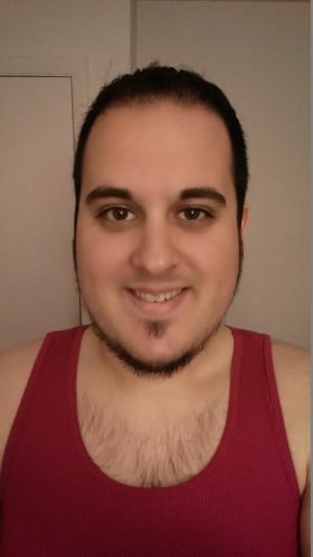 A picture of a 5'11" male showing a weight cut from 280 pounds to 210 pounds. A respectable loss of 70 pounds.