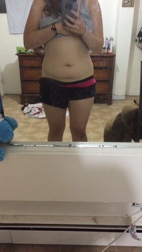 A photo of a 5'4" woman showing a weight loss from 155 pounds to 140 pounds. A net loss of 15 pounds.
