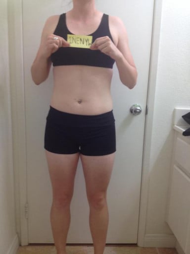 A photo of a 5'4" woman showing a snapshot of 129 pounds at a height of 5'4