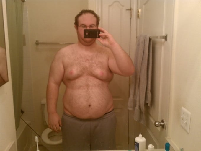A photo of a 5'11" man showing a weight loss from 318 pounds to 227 pounds. A total loss of 91 pounds.