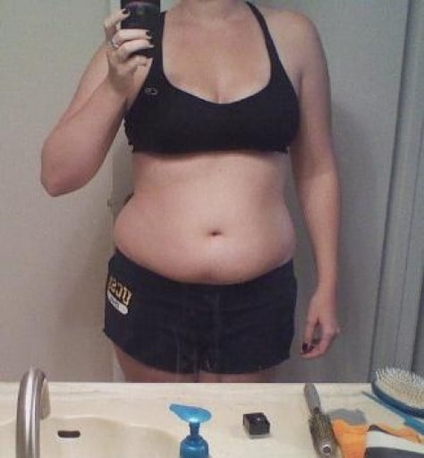 A photo of a 5'5" woman showing a weight loss from 163 pounds to 157 pounds. A net loss of 6 pounds.