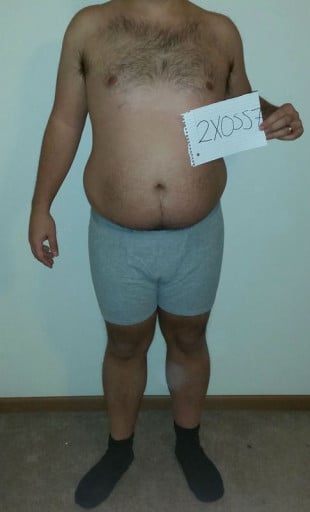 A progress pic of a 5'6" man showing a snapshot of 211 pounds at a height of 5'6