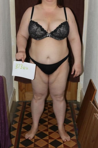 A progress pic of a 5'4" woman showing a snapshot of 239 pounds at a height of 5'4
