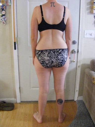 A progress pic of a 5'9" woman showing a snapshot of 165 pounds at a height of 5'9