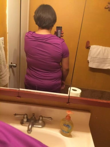 A photo of a 5'3" woman showing a weight reduction from 221 pounds to 196 pounds. A total loss of 25 pounds.